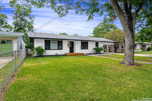 ranch-style home with a front lawn