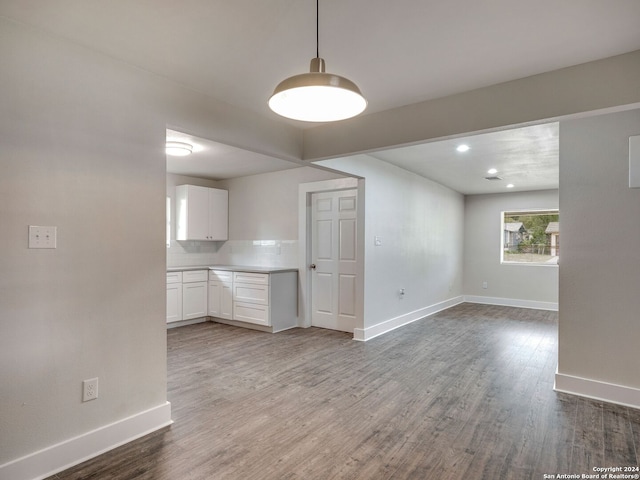 unfurnished living room with hardwood / wood-style flooring