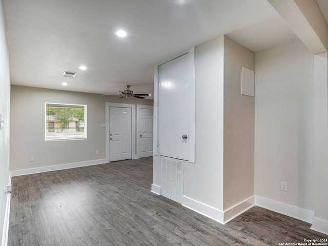 unfurnished room with dark hardwood / wood-style flooring and ceiling fan