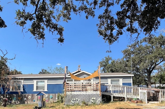 rear view of property with a deck