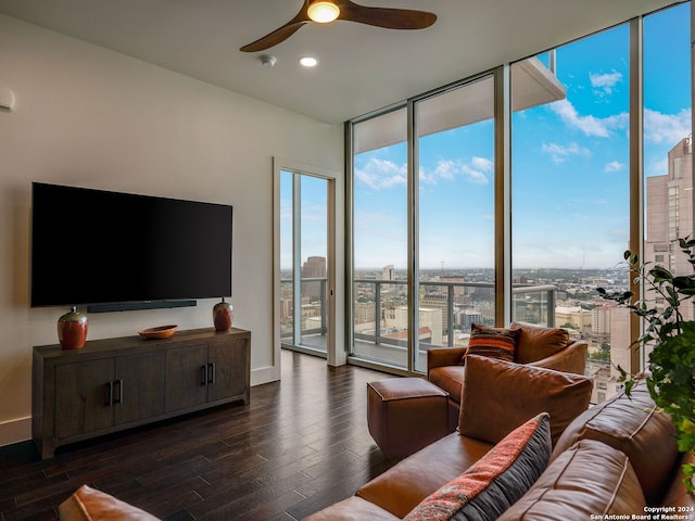 living room featuring floor to ceiling windows, ceiling fan, plenty of natural light, and dark hardwood / wood-style flooring