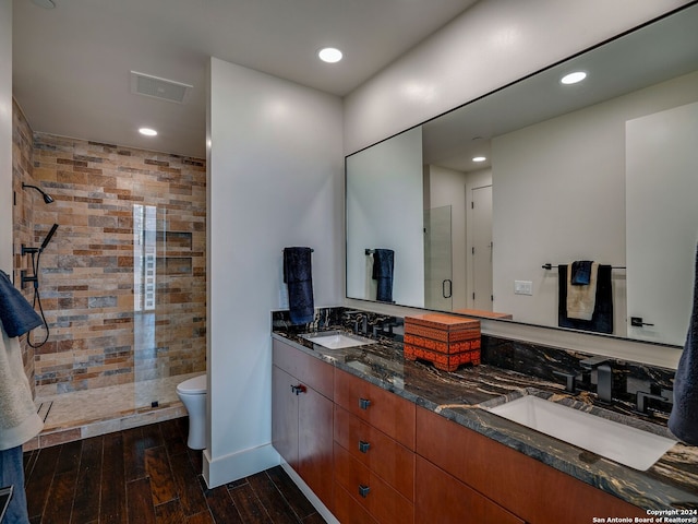 bathroom featuring an enclosed shower, toilet, hardwood / wood-style flooring, and vanity