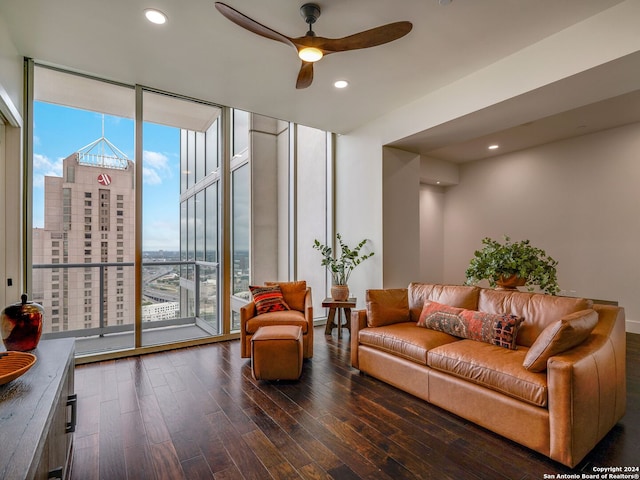 living room with dark wood-type flooring, ceiling fan, and floor to ceiling windows