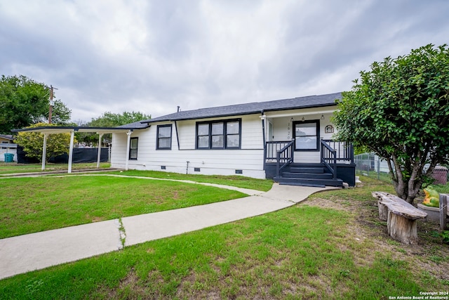 single story home featuring a front lawn