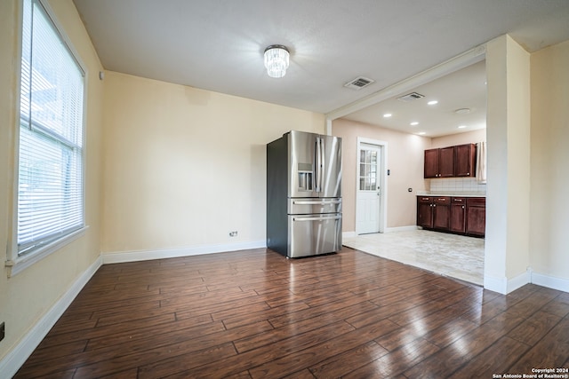 unfurnished living room featuring hardwood / wood-style floors