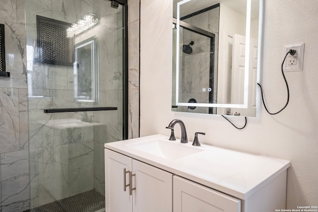 bathroom with vanity and a shower with shower door