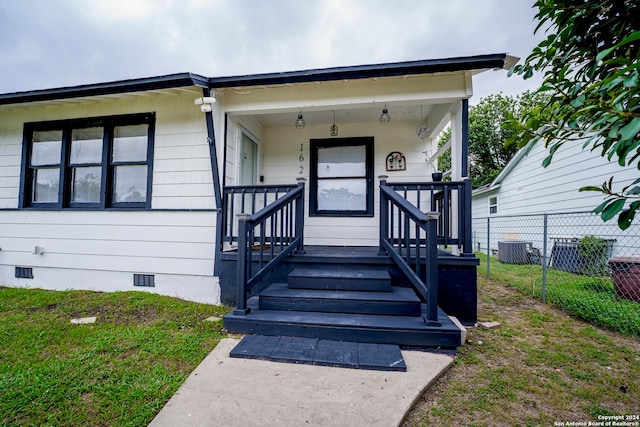 doorway to property featuring covered porch