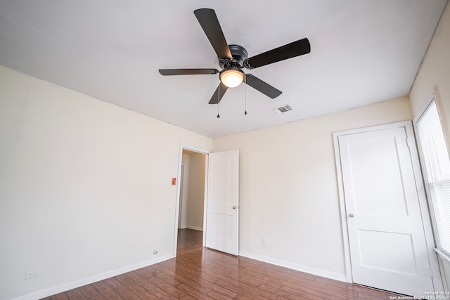 spare room featuring hardwood / wood-style flooring and ceiling fan