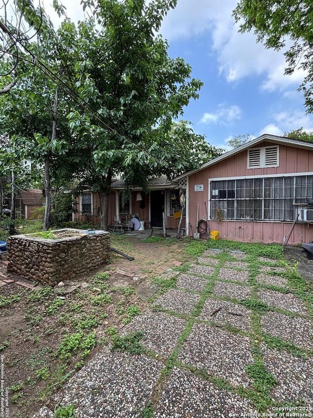 rear view of house with a sunroom