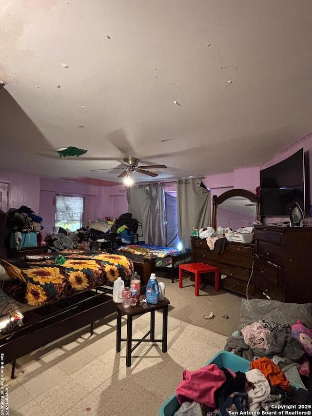 bedroom featuring a ceiling fan and tile patterned floors