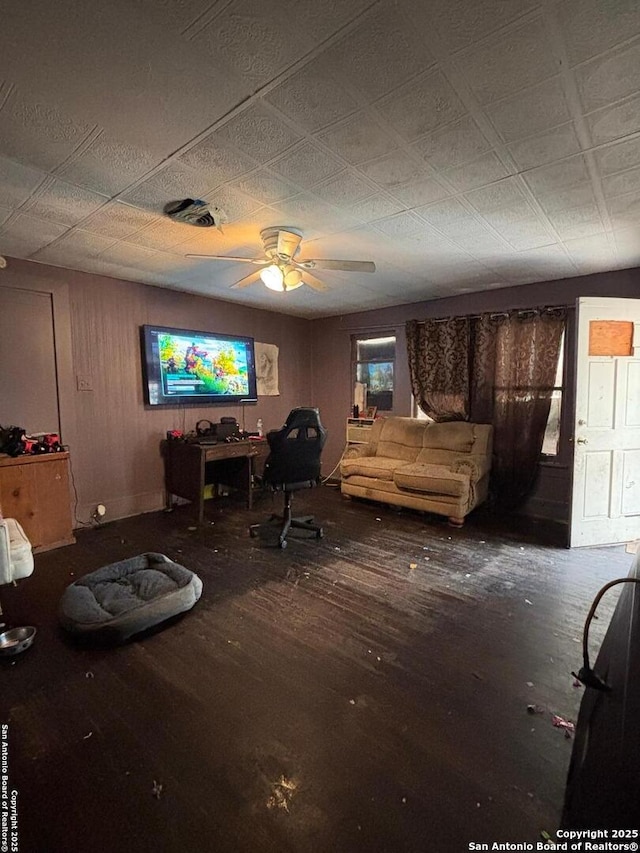 living area featuring a ceiling fan, wood finished floors, and visible vents