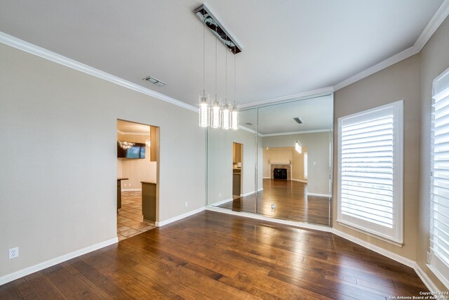 interior space featuring dark hardwood / wood-style floors and ornamental molding