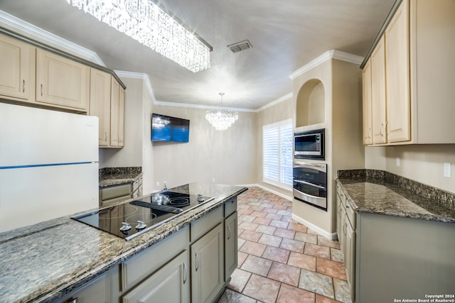 kitchen with crown molding, appliances with stainless steel finishes, a notable chandelier, cream cabinetry, and pendant lighting