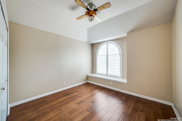 empty room featuring ceiling fan and dark hardwood / wood-style floors