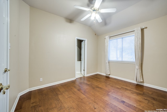 unfurnished room featuring lofted ceiling, ceiling fan, and hardwood / wood-style flooring