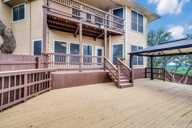 wooden deck featuring a gazebo