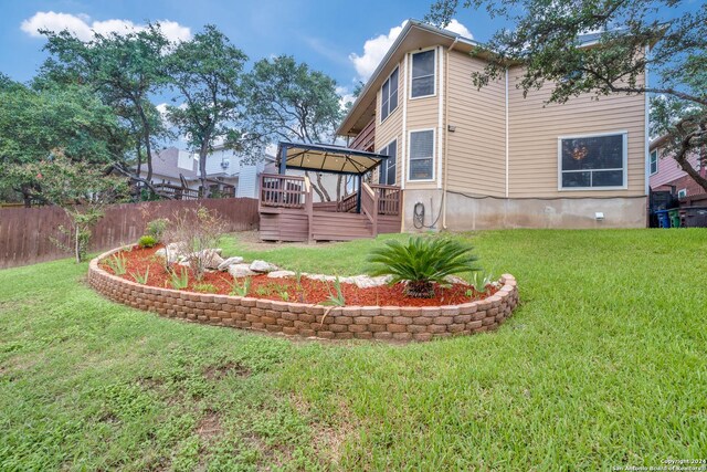 view of yard with a wooden deck