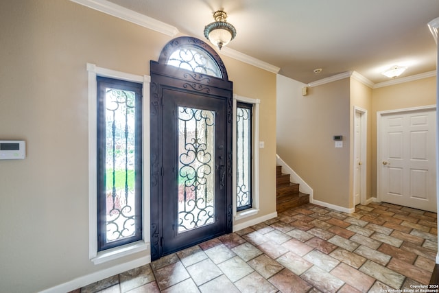 entryway with plenty of natural light and crown molding