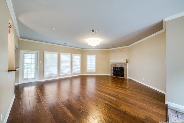 unfurnished living room with dark hardwood / wood-style floors and ornamental molding