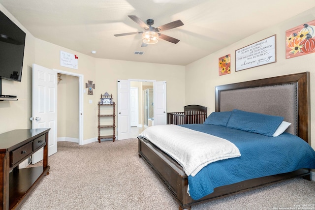 carpeted bedroom featuring ceiling fan