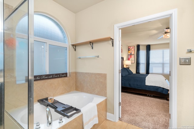 bathroom with ceiling fan, shower with separate bathtub, and tile patterned floors