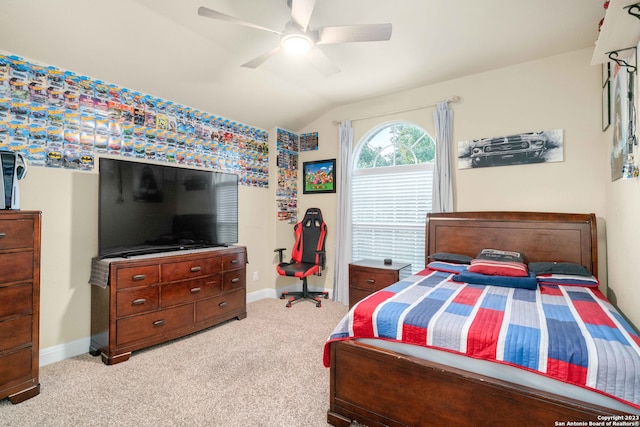 bedroom featuring lofted ceiling, ceiling fan, and light colored carpet