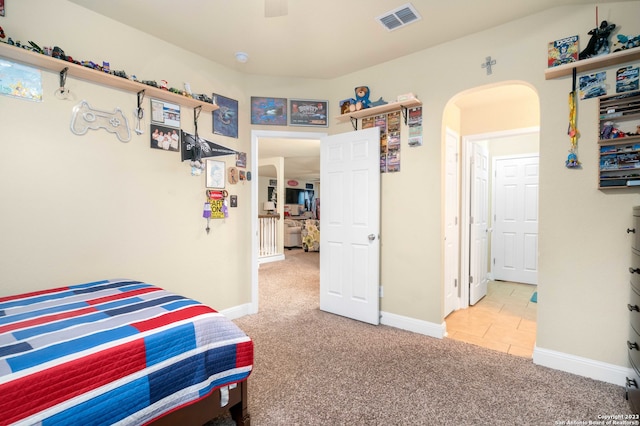 bedroom with light carpet