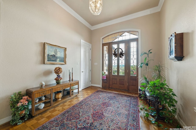 entryway with crown molding, parquet floors, and a notable chandelier