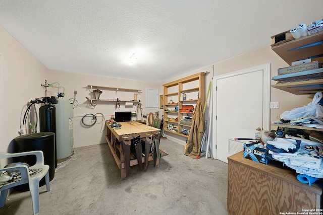 miscellaneous room with concrete floors and a textured ceiling