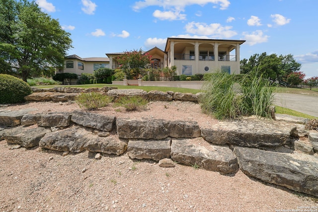 view of front of property with a balcony