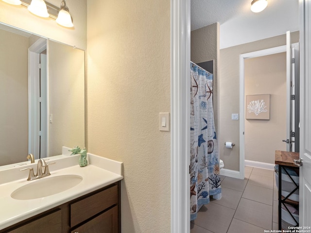 bathroom with vanity and tile patterned flooring