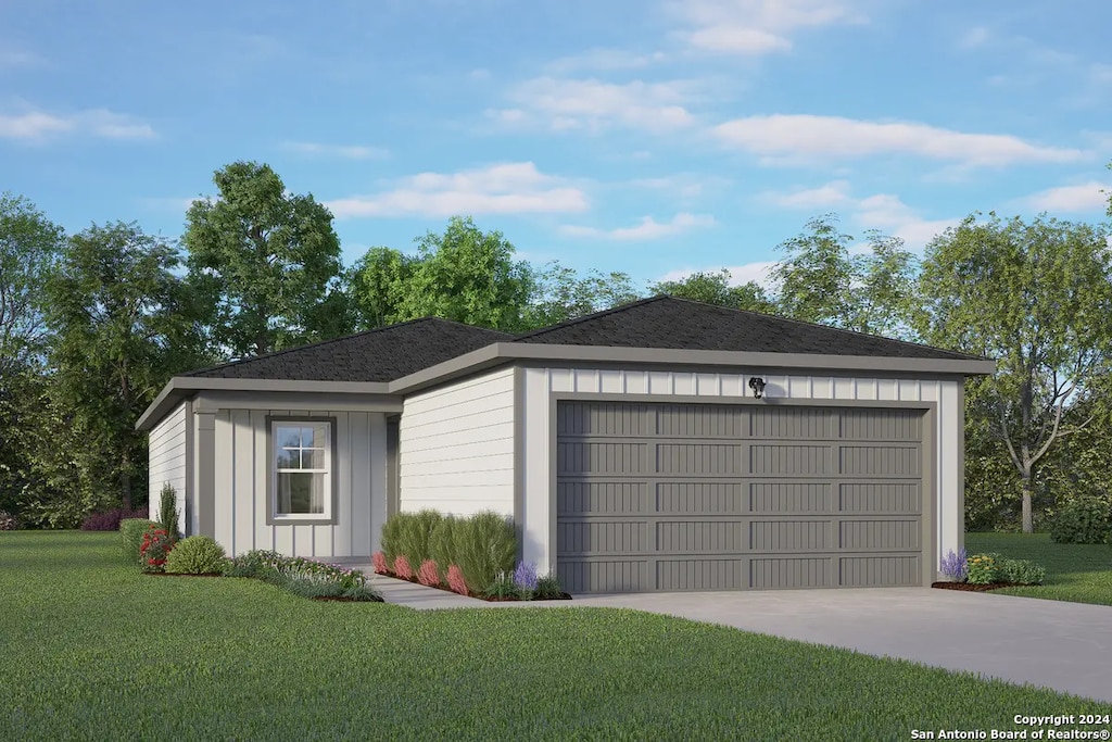 view of front facade with a garage and a front lawn