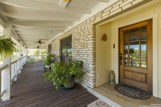 deck with ceiling fan and a porch