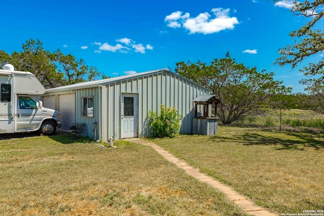 exterior space with a lawn and a garage