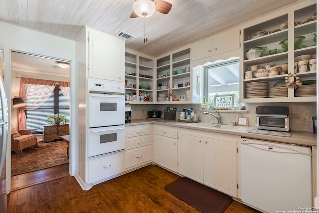 kitchen featuring white appliances, plenty of natural light, dark hardwood / wood-style floors, and sink