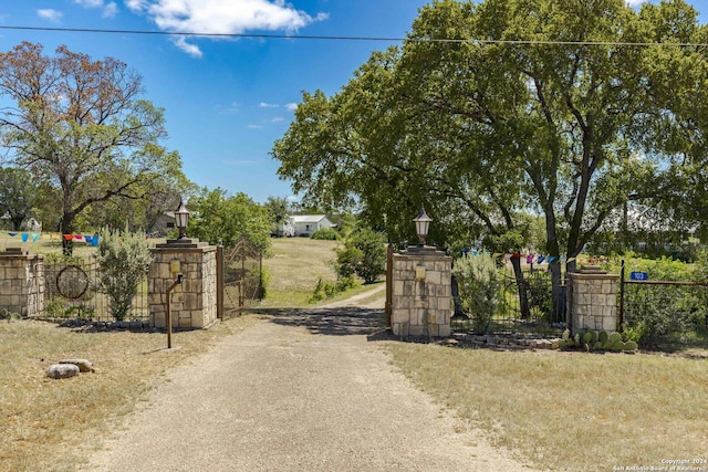 view of gate with fence