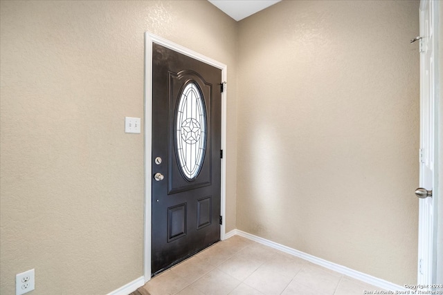 foyer with light tile patterned floors