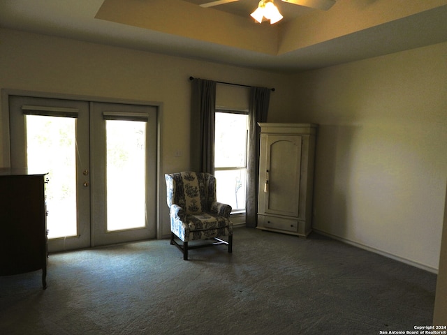 living area featuring french doors, plenty of natural light, dark carpet, and ceiling fan