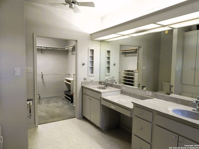 bathroom featuring vanity, ceiling fan, and toilet