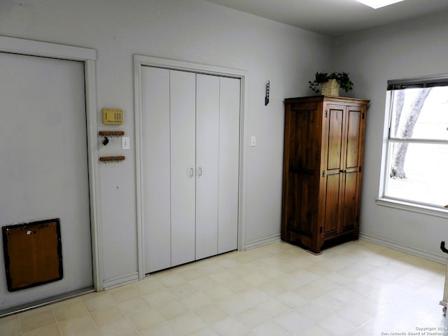 unfurnished bedroom featuring multiple windows