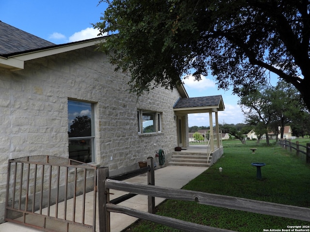 view of home's exterior featuring a yard