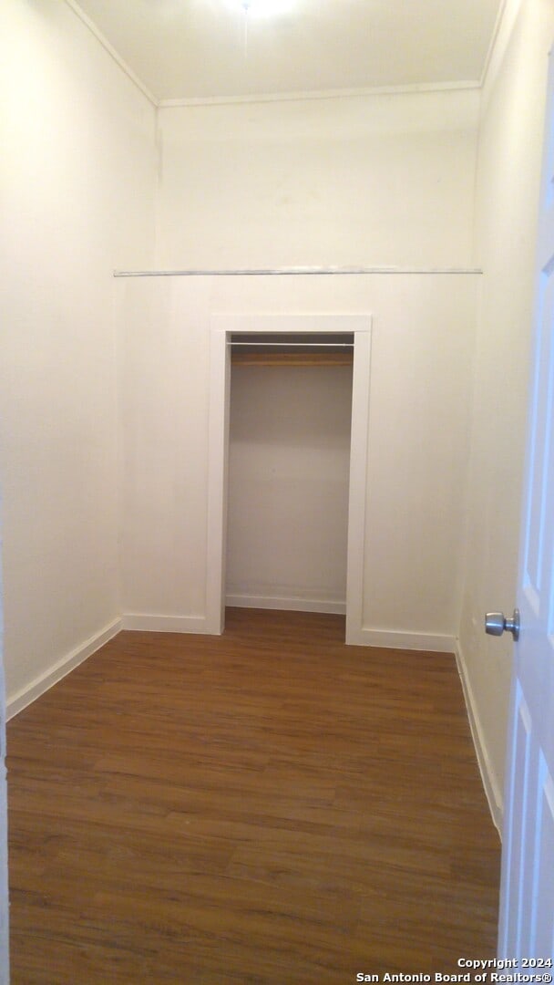 empty room featuring dark hardwood / wood-style flooring