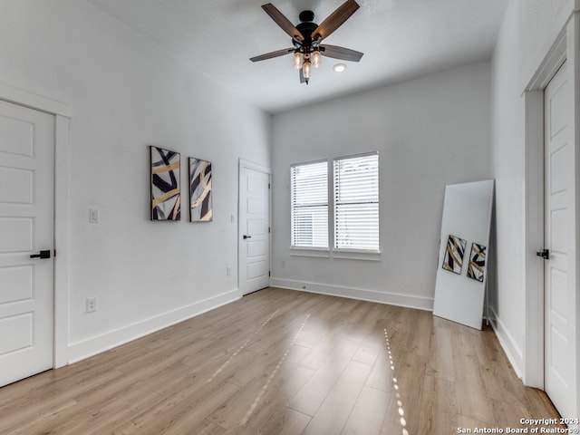 unfurnished room featuring ceiling fan and light wood-type flooring