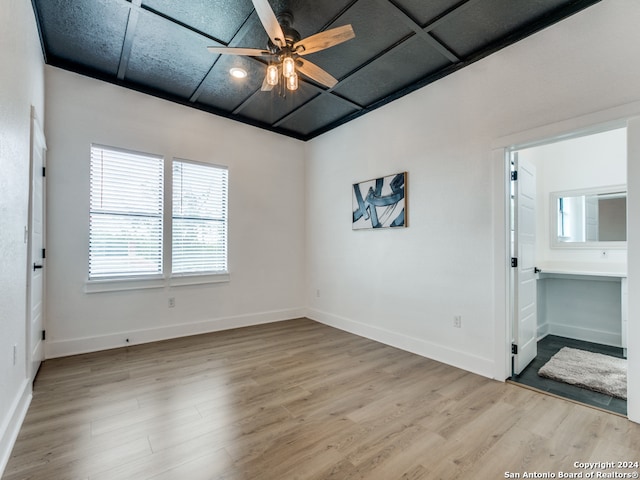 spare room featuring light hardwood / wood-style flooring and ceiling fan