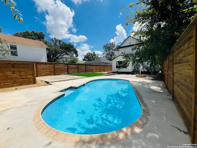 view of pool with a patio area