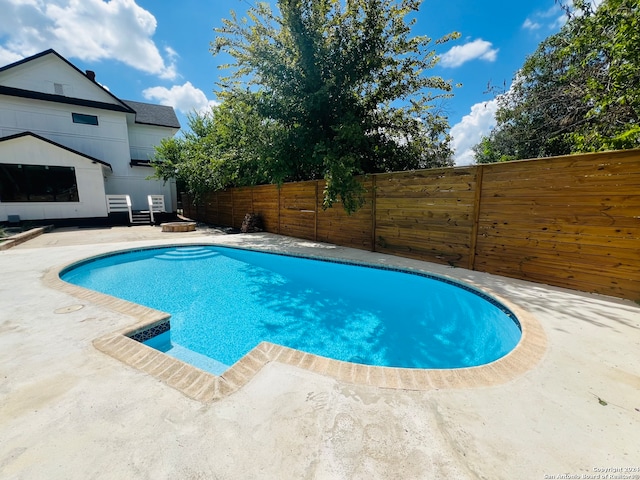 view of pool featuring a patio area