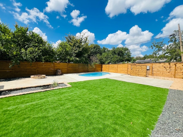 view of yard with a fire pit and a patio area