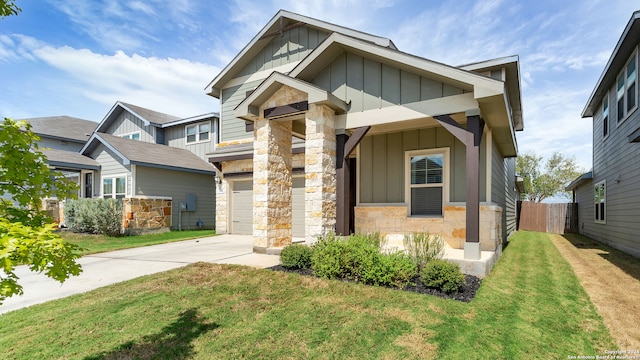 craftsman-style house with a garage and a front yard