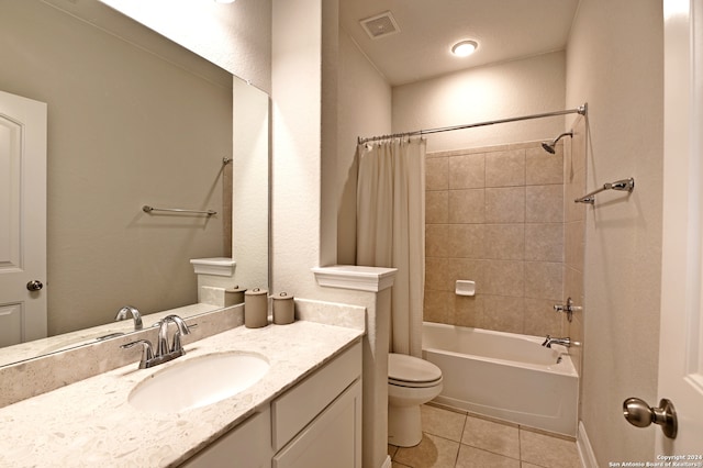 full bathroom with tile patterned flooring, toilet, shower / tub combo, and vanity