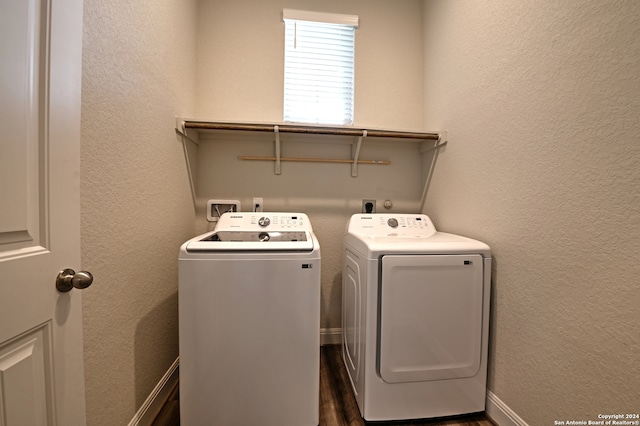 laundry room featuring separate washer and dryer and dark hardwood / wood-style flooring